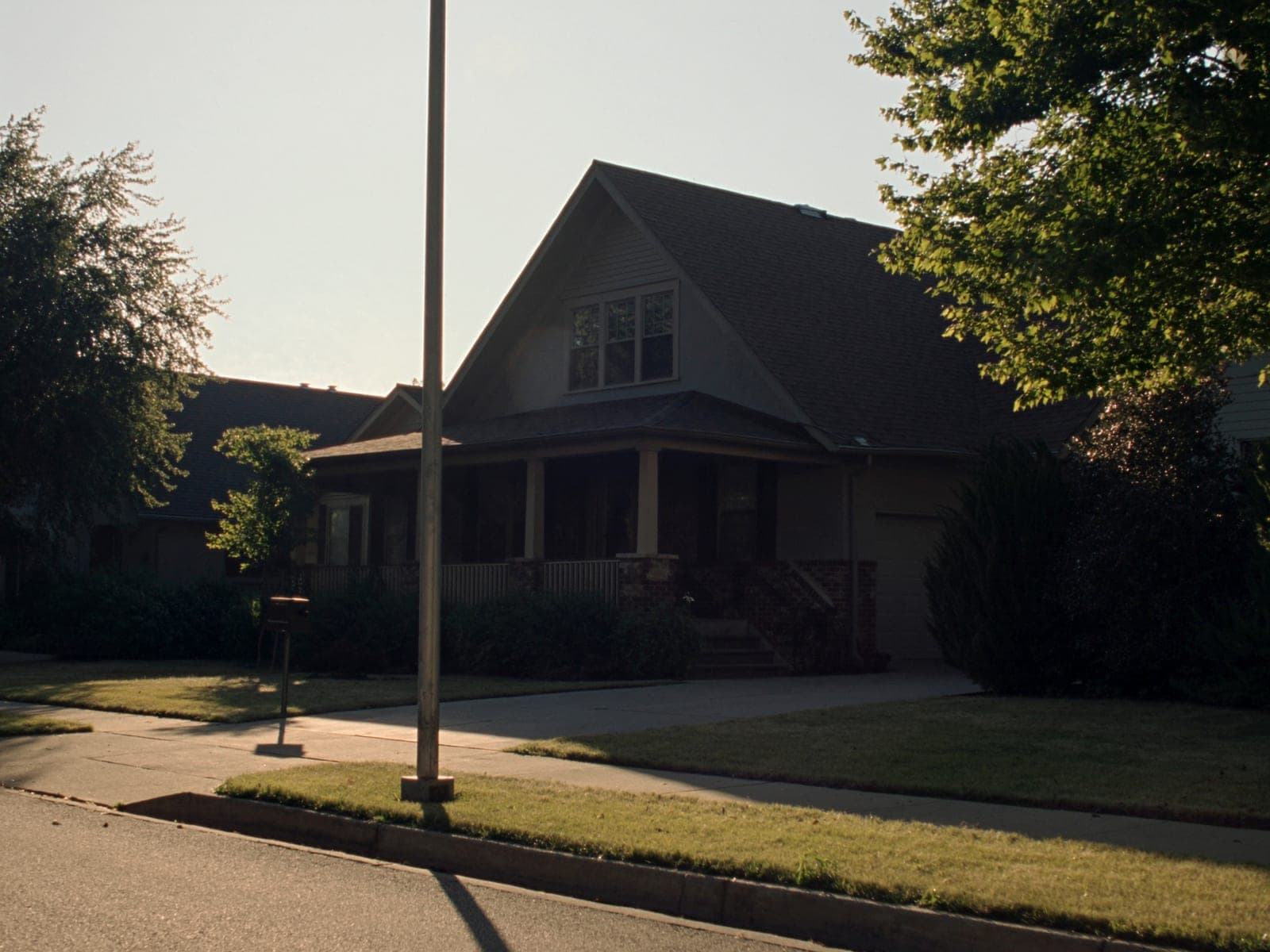 Exterior of a well-kept suburban Minnesota home in afternoon light
